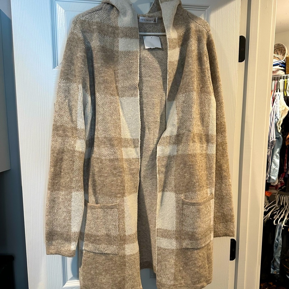 Woman’s brand new long sweater/cardigan